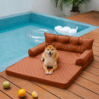 Dog lounging on the faux leather orthopedic pet sofa bed