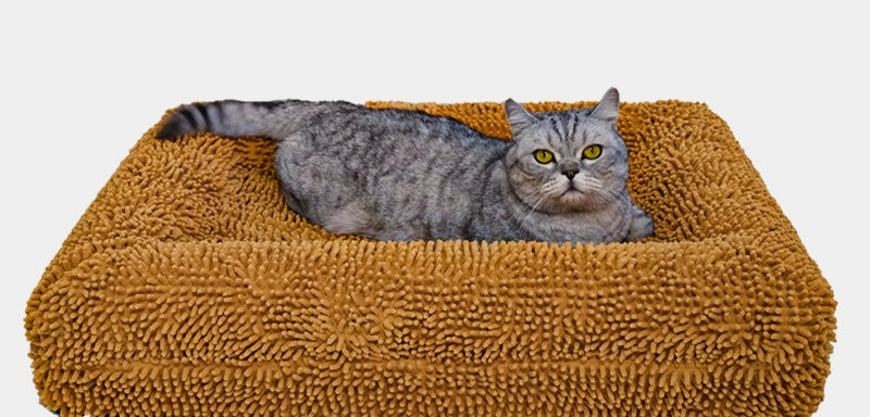 Dog resting on the PawLab LuxeNest orthopedic bolster bed in brown
